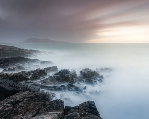 Seascapes of the Outer Hebrides:  a rocky cliff overlooking a body of water