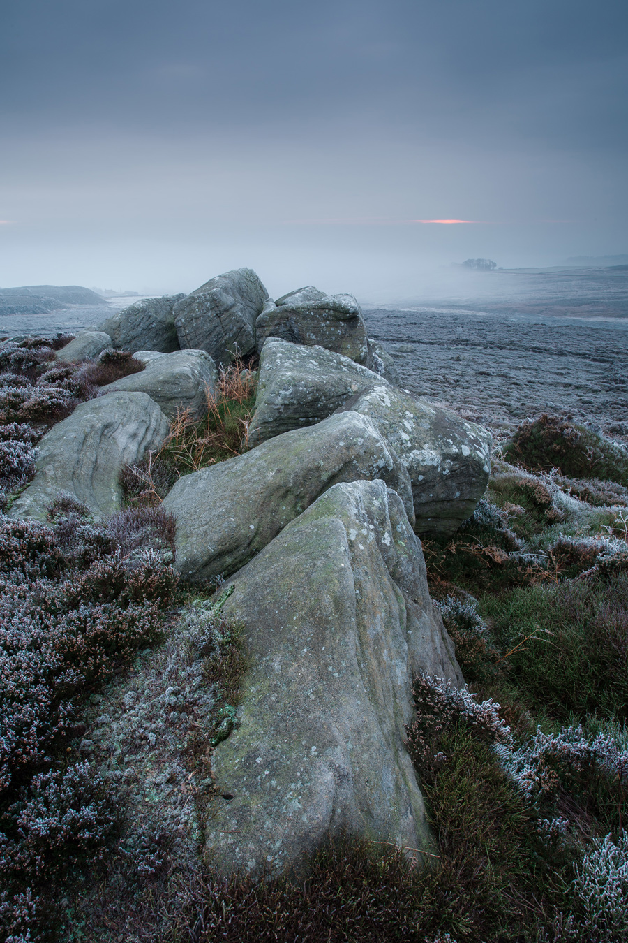 Frosty moorland landscape a close up of a rock