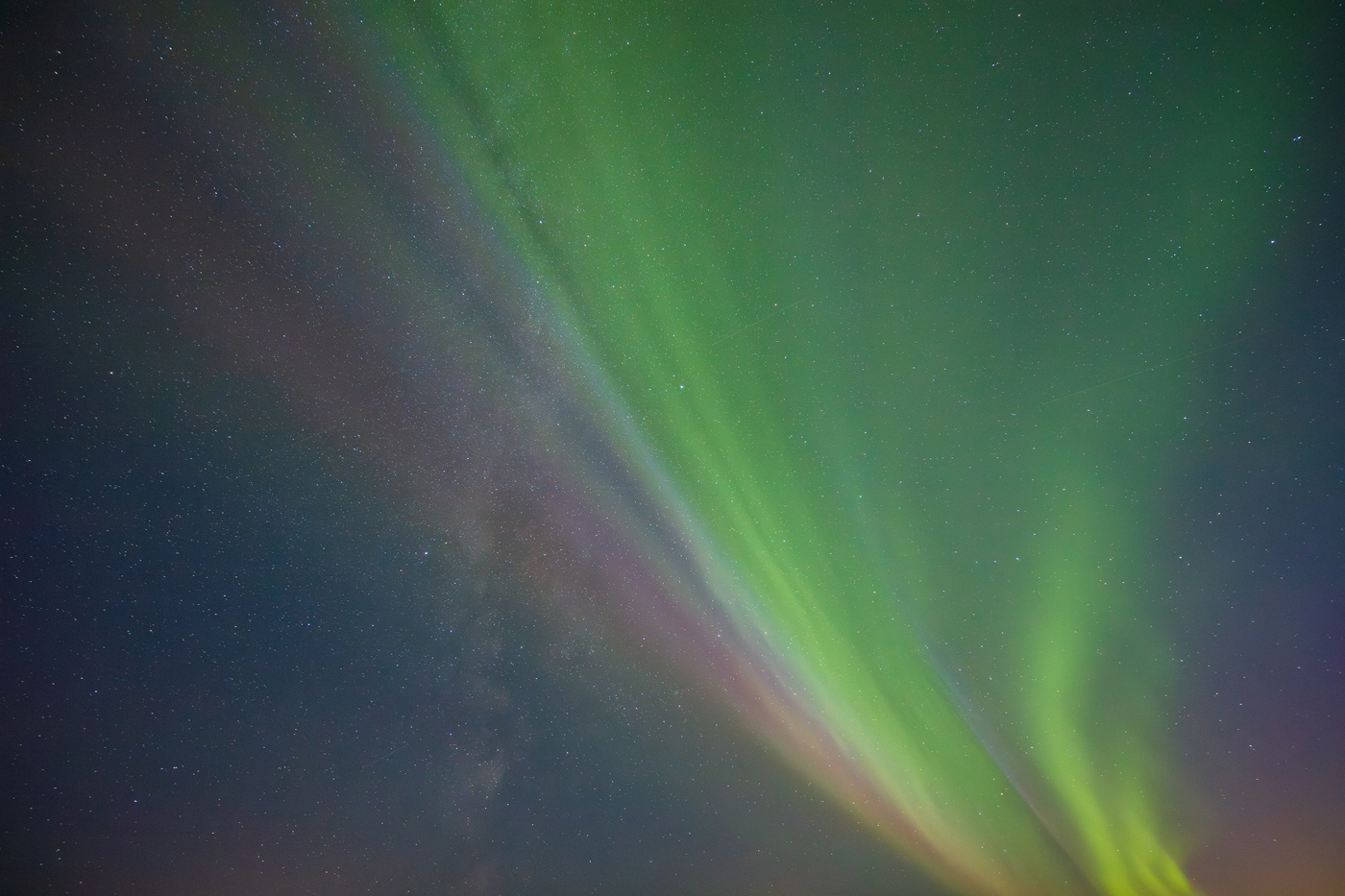 a green and purple aurora borealis