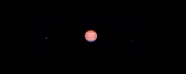Jupiter with the shadow its moon Io through a 80mm refractor