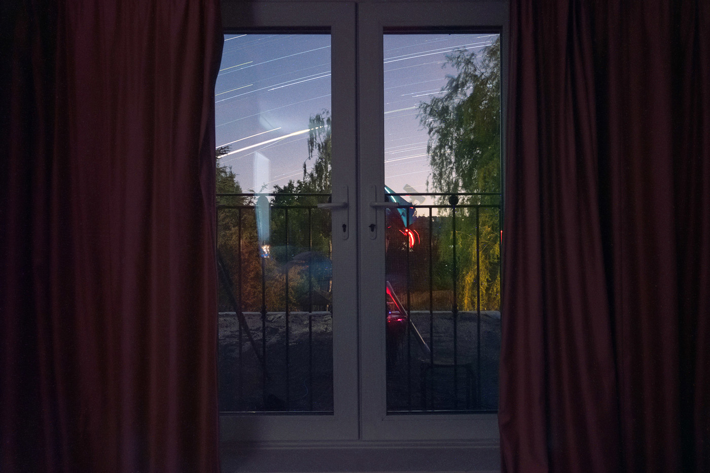  a red curtain and a window