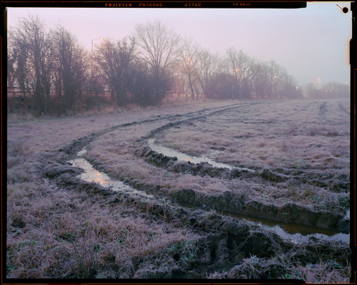 Edge Land:  a view of a dirt field