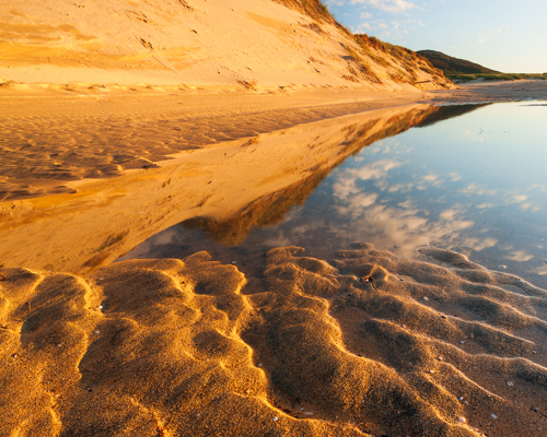 Seascapes of the Outer Hebrides:  a sandy beach with a body of water in the middle