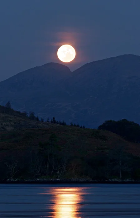 The moon sets