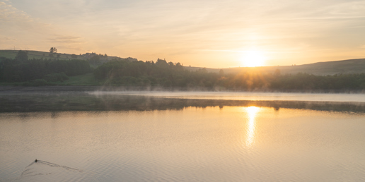  a sunset over a body of water