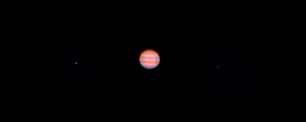 Jupiter with the shadow its moon Io through a 80mm refractor