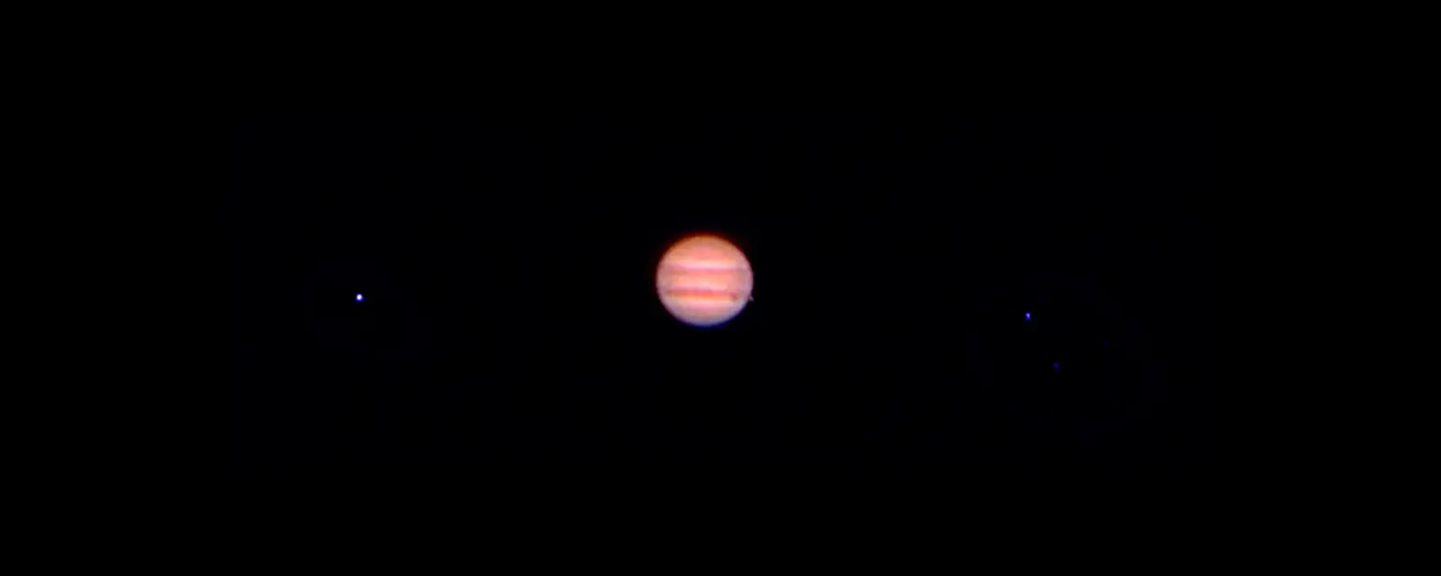 Jupiter with the shadow its moon Io through a 80mm refractor